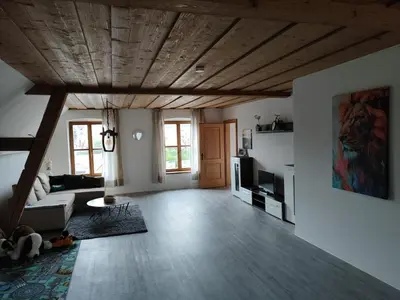 Ein Sitzbereich in der Unterkunft Ferienwohnung Bruckmühle