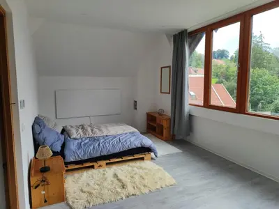 Ein Bett oder Betten in einem Zimmer der Unterkunft Ferienwohnung Bruckmühle