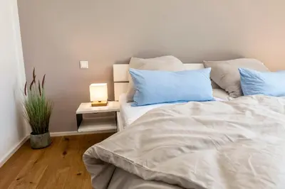 Ein Bett oder Betten in einem Zimmer der Unterkunft Ferienwohnung Buchwald