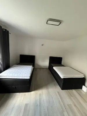 Ein Bett oder Betten in einem Zimmer der Unterkunft Stilvolle Wohnung im Erdgeschoss