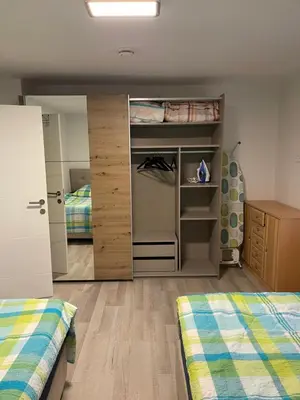 Ein Bett oder Betten in einem Zimmer der Unterkunft Stilvolle Wohnung im Erdgeschoss