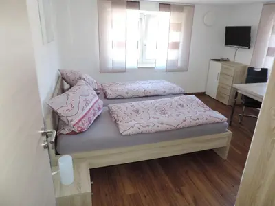 Ein Bett oder Betten in einem Zimmer der Unterkunft Pension am Kirchberg