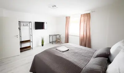 Ein Bett oder Betten in einem Zimmer der Unterkunft Nahe Rathaus & Dom - 1,5-, 2- oder 3 ZKB-Apartments im Zentrum
