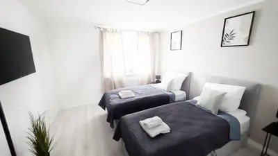 Ein Bett oder Betten in einem Zimmer der Unterkunft Nahe Rathaus & Dom - 1,5-, 2- oder 3 ZKB-Apartments im Zentrum