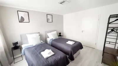 Ein Bett oder Betten in einem Zimmer der Unterkunft Nahe Rathaus & Dom - 1,5-, 2- oder 3 ZKB-Apartments im Zentrum