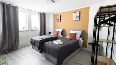 Ein Bett oder Betten in einem Zimmer der Unterkunft Nahe Rathaus & Dom - 1,5-, 2- oder 3 ZKB-Apartments im Zentrum