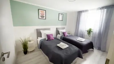 Ein Bett oder Betten in einem Zimmer der Unterkunft Nahe Rathaus & Dom - 1,5-, 2- oder 3 ZKB-Apartments im Zentrum
