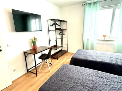 Ein Bett oder Betten in einem Zimmer der Unterkunft Nahe Rathaus & Dom - 1,5-, 2- oder 3 ZKB-Apartments im Zentrum