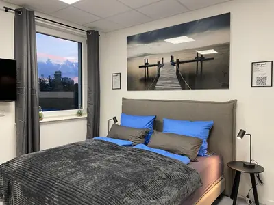 Ein Bett oder Betten in einem Zimmer der Unterkunft SweetHome - Studio Apartment Ergolding