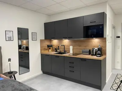 Küche/Küchenzeile in der Unterkunft SweetHome - Studio Apartment Ergolding
