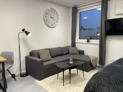 Ein Sitzbereich in der Unterkunft SweetHome - Studio Apartment Ergolding