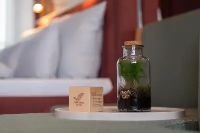 Ein Bett oder Betten in einem Zimmer der Unterkunft Cocoon Theresienwiese