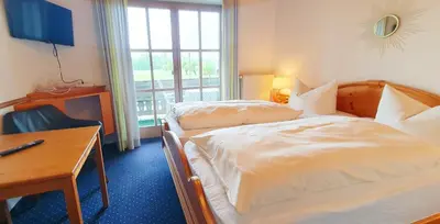 Ein Bett oder Betten in einem Zimmer der Unterkunft Pension Steiner
