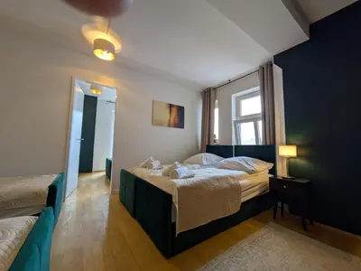 Ein Bett oder Betten in einem Zimmer der Unterkunft Munich Large Apartment 110 qm, 3 Bedrooms and very Central 1-12 Guests