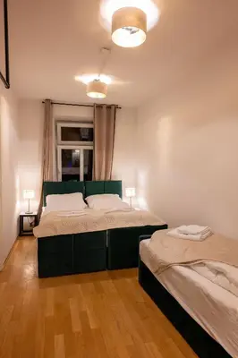 Ein Bett oder Betten in einem Zimmer der Unterkunft Munich Large Apartment 110 qm, 3 Bedrooms and very Central 1-12 Guests