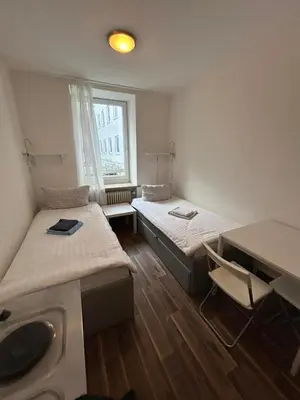 Ein Bett oder Betten in einem Zimmer der Unterkunft 2-Rent Group Hostel Apartments SEN14