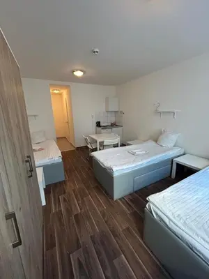 Ein Bett oder Betten in einem Zimmer der Unterkunft 2-Rent Group Hostel Apartments SEN14