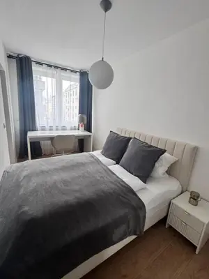 Ein Bett oder Betten in einem Zimmer der Unterkunft Modern City Apartment 1