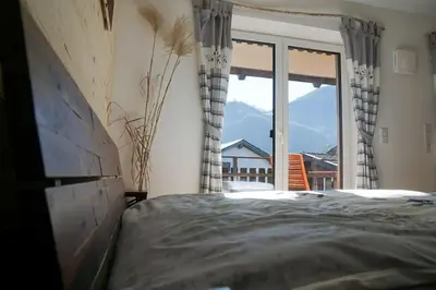 Ein Bett oder Betten in einem Zimmer der Unterkunft Wohnung Heuberg im Inntal mit Hot Tube - zentral & ruhig