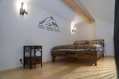 Ein Bett oder Betten in einem Zimmer der Unterkunft Loftwohnung Kaiserblick im Inntal - 83 qm - zentral & ruhig