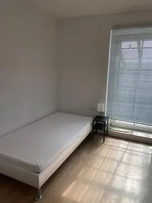 Ein Bett oder Betten in einem Zimmer der Unterkunft Ferienwohnung mit 3 Schlafzimmern im 1 Stock