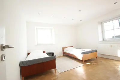 Ein Bett oder Betten in einem Zimmer der Unterkunft Ferienwohnung mit 3 Schlafzimmern im 1 Stock