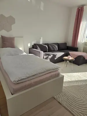 Ein Bett oder Betten in einem Zimmer der Unterkunft Ferienwohnung Weitblick