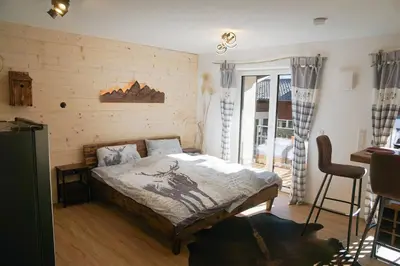 Ein Bett oder Betten in einem Zimmer der Unterkunft Wohnung Wendelstein mit Bergblick im Inntal - zentral & ruhig