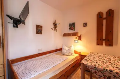 Ein Bett oder Betten in einem Zimmer der Unterkunft Ferienhaus Rosengarten