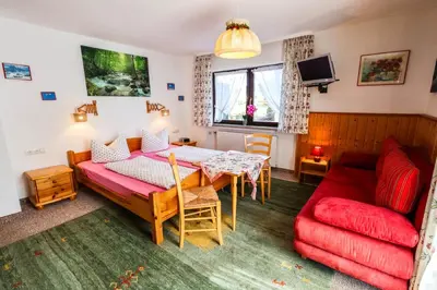 Ein Bett oder Betten in einem Zimmer der Unterkunft Ferienhaus Rosengarten