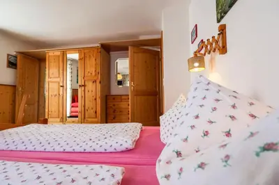 Ein Bett oder Betten in einem Zimmer der Unterkunft Ferienhaus Rosengarten