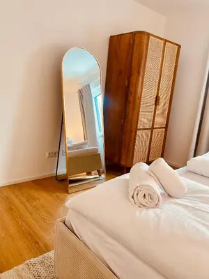 Ein Bett oder Betten in einem Zimmer der Unterkunft Liboria I Stylische Maisonette Wohnung Alpenblick I 4min zum See