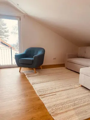 Ein Sitzbereich in der Unterkunft Liboria I Stylische Maisonette Wohnung Alpenblick I 4min zum See
