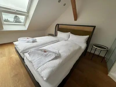 Ein Bett oder Betten in einem Zimmer der Unterkunft ღLIBORIA I Als Gruppe in Uffing I 4 min zum See I Sauna