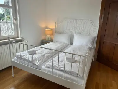 Ein Bett oder Betten in einem Zimmer der Unterkunft ღLIBORIA I Als Gruppe in Uffing I 4 min zum See I Sauna
