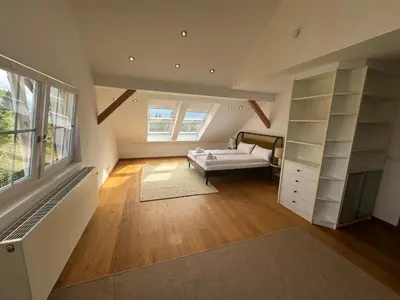 Ein Bett oder Betten in einem Zimmer der Unterkunft ღLIBORIA I Als Gruppe in Uffing I 4 min zum See I Sauna
