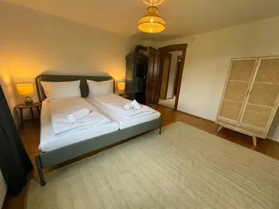 Ein Bett oder Betten in einem Zimmer der Unterkunft ღLIBORIA I Als Gruppe in Uffing I 4 min zum See I Sauna
