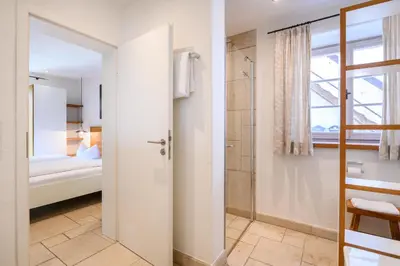 Ein Bett oder Betten in einem Zimmer der Unterkunft Alpenkönig I