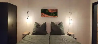Ein Bett oder Betten in einem Zimmer der Unterkunft Ferienwohnung Waldgeflüster