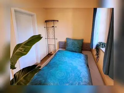Ein Bett oder Betten in einem Zimmer der Unterkunft Ferienwohnung Sunseid n