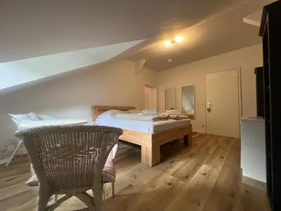 Ein Bett oder Betten in einem Zimmer der Unterkunft ciao-aschau Haus zur Burg Apartment 305 Geres