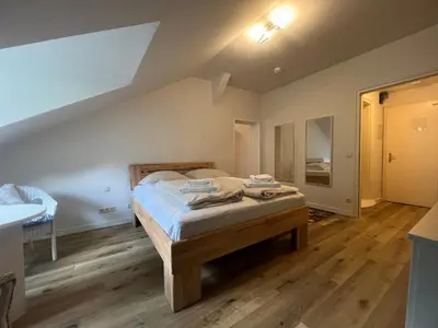 Ein Bett oder Betten in einem Zimmer der Unterkunft ciao-aschau Haus zur Burg Apartment 305 Geres