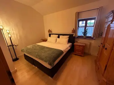 Ein Bett oder Betten in einem Zimmer der Unterkunft Ferienwohnung Stüberl inklusive Königscard