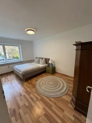 Ein Bett oder Betten in einem Zimmer der Unterkunft Quiet Family Apartment - 10 min to Center & Oktoberfest - Free Parking - Balcony - near Nymphenburg Palace & Botanical garden