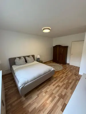 Ein Bett oder Betten in einem Zimmer der Unterkunft Quiet Family Apartment - 10 min to Center & Oktoberfest - Free Parking - Balcony - near Nymphenburg Palace & Botanical garden