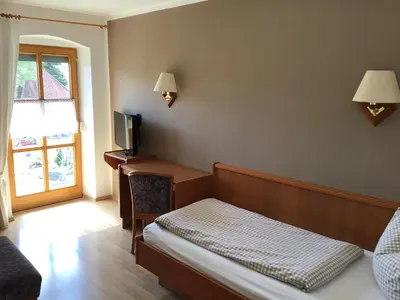 Ein Bett oder Betten in einem Zimmer der Unterkunft Gasthof Oberer Wirt Biburg