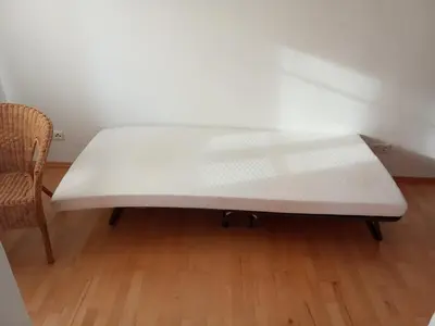 Ein Bett oder Betten in einem Zimmer der Unterkunft Maisonette mit Kaminöfen Nähe Starnberger See und München