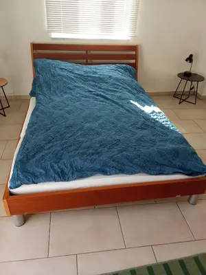 Ein Bett oder Betten in einem Zimmer der Unterkunft Maisonette mit Kaminöfen Nähe Starnberger See und München