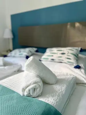 Ein Bett oder Betten in einem Zimmer der Unterkunft bloom - klein und fein mit Seezugang u WLAN
