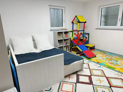 Ein Bett oder Betten in einem Zimmer der Unterkunft EMMA Gardencity Basement Flat
